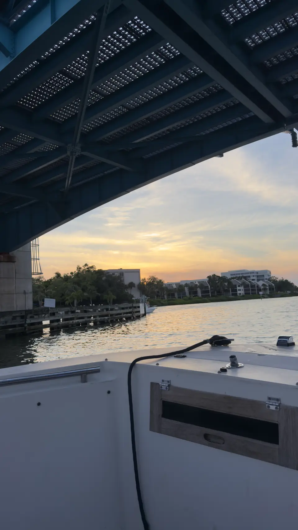 Sunset view from a boat passing under a bridge on the Intracoastal