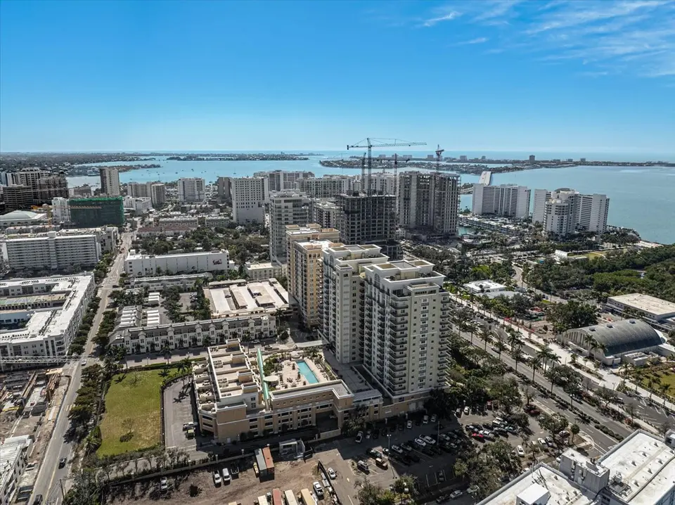 Aerial view of downtown Sarasota towers with Sarasota Bay on the horizon