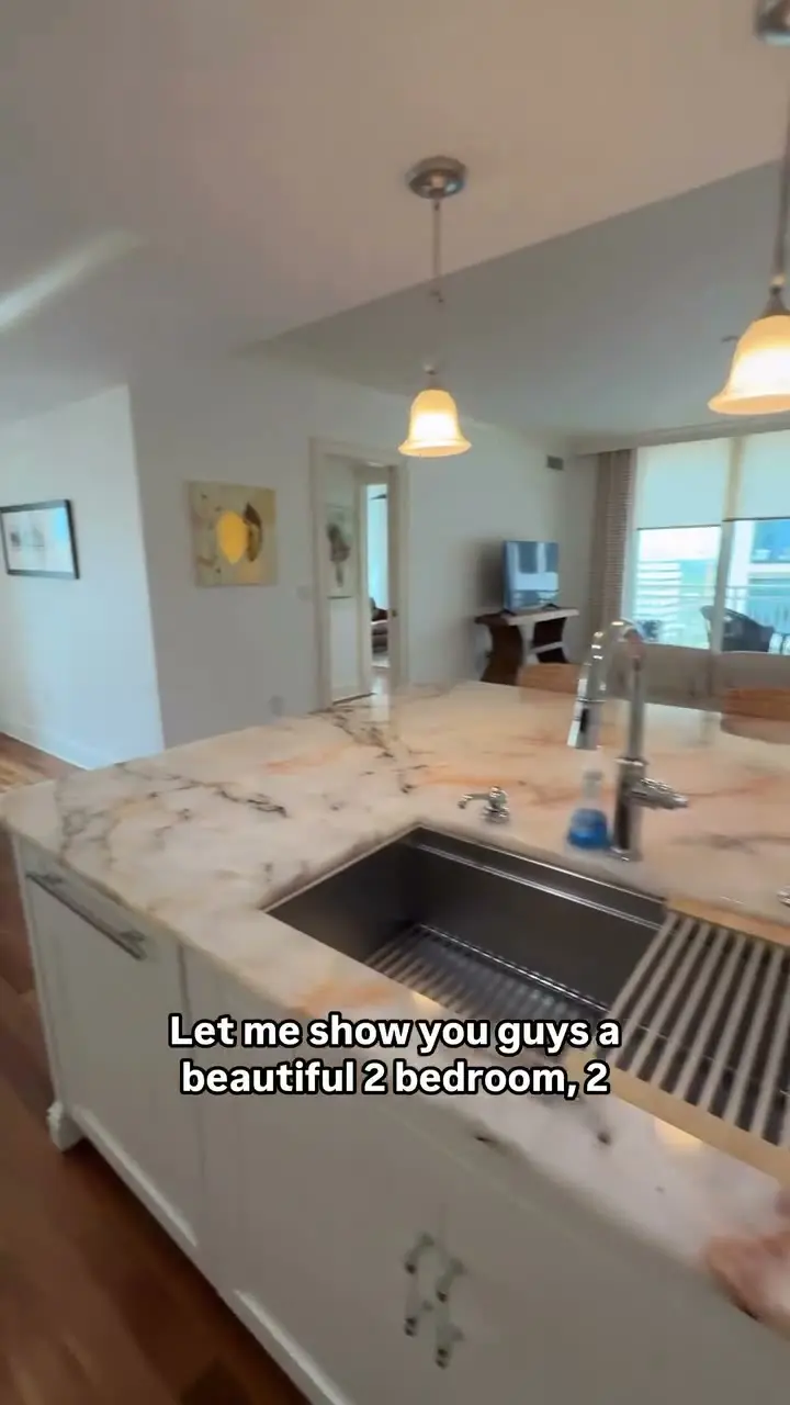 Condo kitchen with granite counters and a bay view