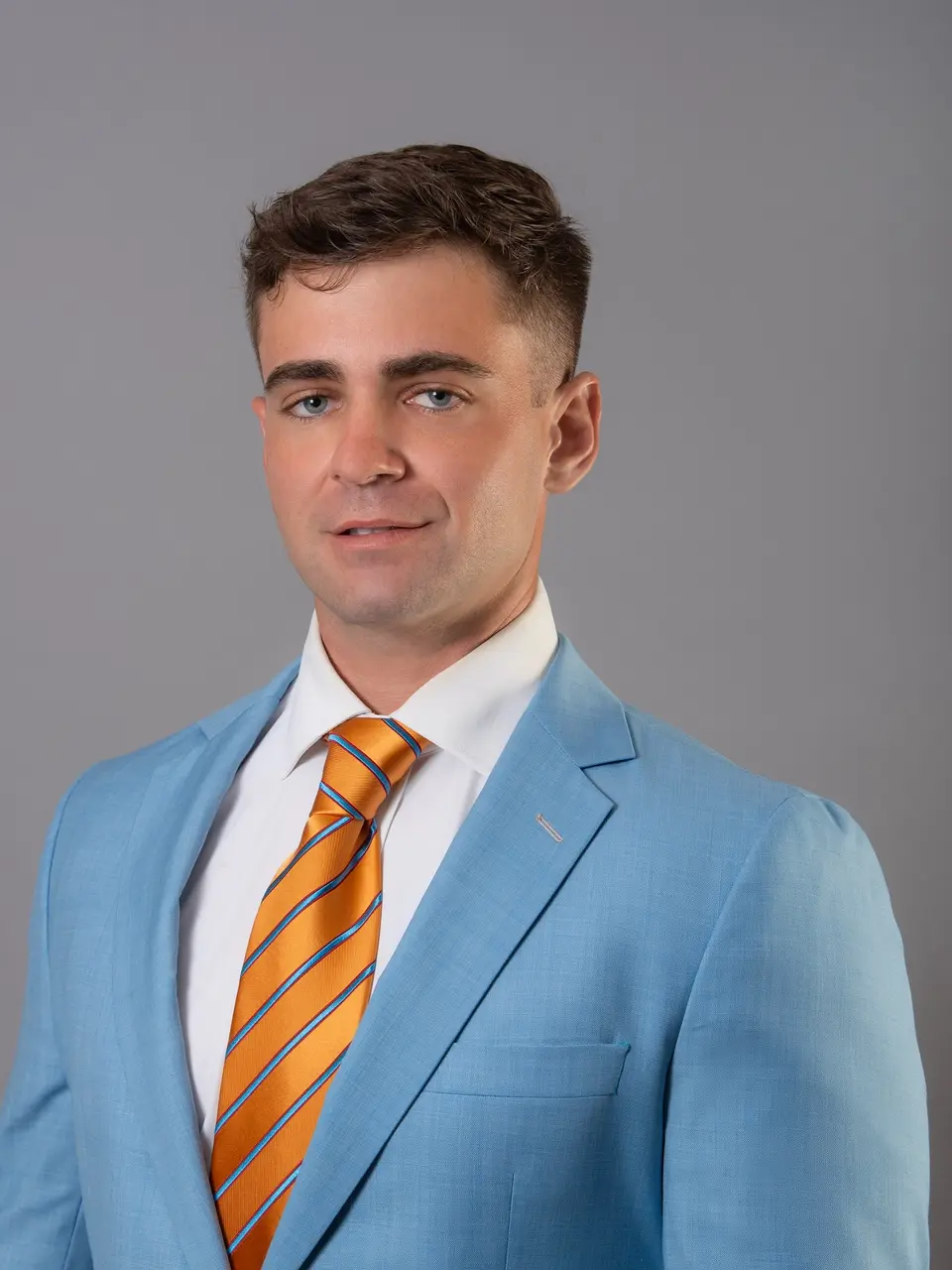 Richard Ivan, REALTOR® and Property Manager with Wagner Realty, in a light blue suit